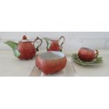 A porcelain 'strawberry' miniature tea set.