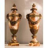 A pair of gilt metal and marble French urns/garnit