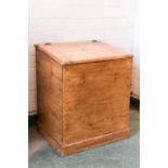 An antique pine box/linen box with a sloped lid.