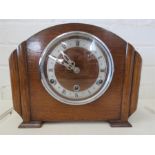 A 1930s oak cased mantle clock.