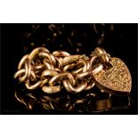 A 9ct gold hollow curb bracelet with heart form cl