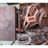 A group of tools and horns, incluing a vintage car