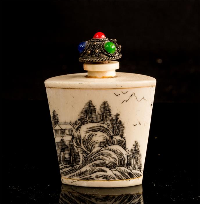 A Chinese etched snuff/scent bottle and cover.