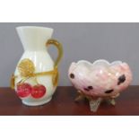 An opaque glass vase with cherry decoration, and a