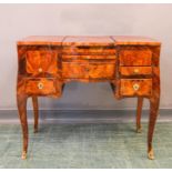 An 18th century Poudreusse Louis XV dressing table, in rosewood, kingwood and satinwood veneer,