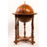An antique library globe on stand.