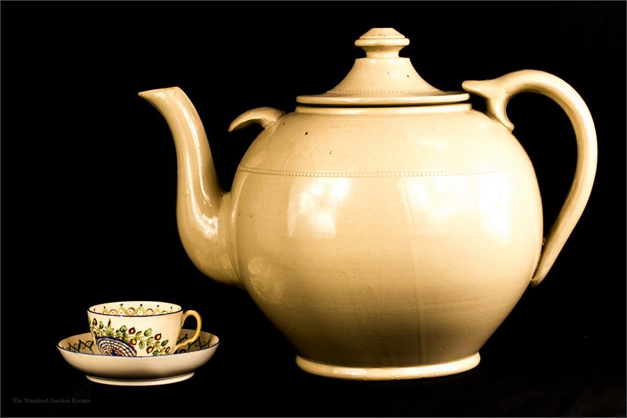 A large stoneware glazed tea pot, 30cm high.