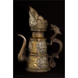 A Tibetan brass white metal and bronze ewer, with