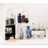 A group of excavated and other glass bottles, some
