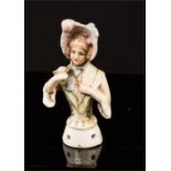 A German porcelain doll top.