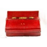 A red leather early 20th century ladies vanity cas