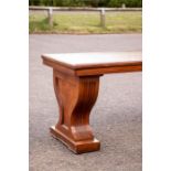 A 19th century mahogany bench with vase-form ends,