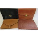 Two leather and two faux leather folios.