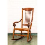 An Edwardian mahogany spindle back rocking chair.