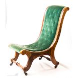 A Victorian mahogany nursing chair with velvet but