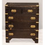 A small Campaign style chest of drawers.