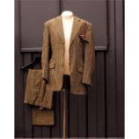 A bespoke single breasted suit jacket and pocket s