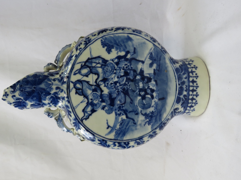 A blue and white 19th century moon flask.