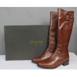 A pair of Dune tan leather boots, size 5 with orig