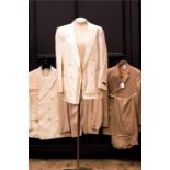 A cream linen suit set, a camel coloured linen sui