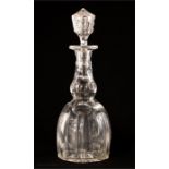 A cut glass decanter.