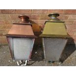 An outdoor copper lantern and a similar brass lant