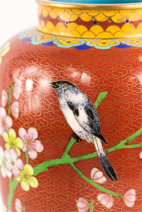 A Cloisonne vase, depicting a bird.