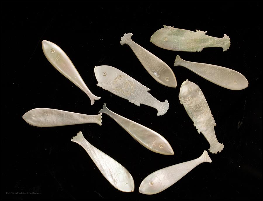 A group of Chinese mother of pearl counters in the