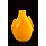 A yellow peking glass snuff bottle.