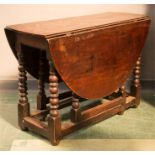 An oak gateleg table.