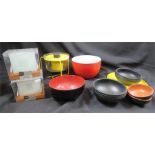 A group of kitchenalia including two sets of glass place mats and bowls.