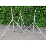 Four photography tripods.