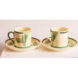 A pair of Crown Staffordshire green geometric pattern coffee cans and saucers.