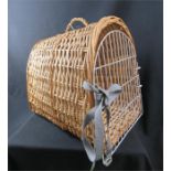 A dome topped wicker pet carrying basket, 47cm deep.