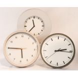 Three round faced clocks: one by Muji; 24cm, one by Habitat; 25.5cm and one Ikea; 25cm diameter.