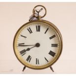 A circular brass cased clock with enamelled Roman numeral dial, 14cm.