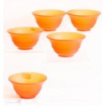 A set of five amber satin glass desert dishes, 14cm diameter.