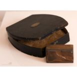 A copper printing block ‘Worn in Any Boot’ and a black metal negative case by Hardy Bros.