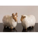 A pair of pottery Ewe and Ram.