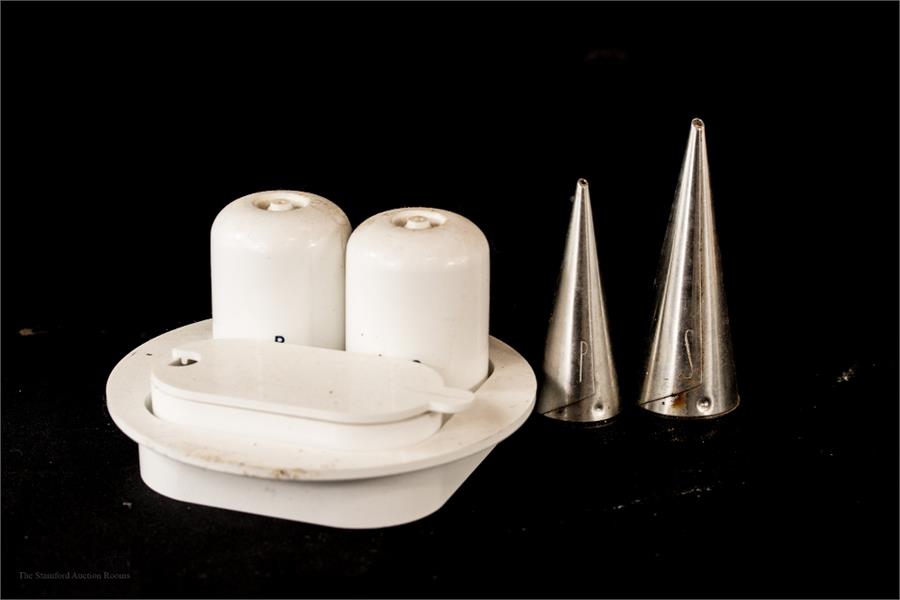 Two cruet sets: one of conical form in stainless steel, the other in white plastic form comprising