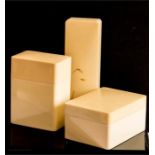 A Crayonne three piece moulded ivory desk set comprising three lidded boxes.