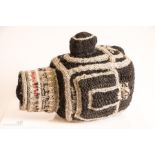 A glass model of a Hasselblad camera and a knitted Hasselblad.