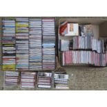 A collection of CDs, including a modern white CD wall rack of CDs.