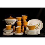 A retro mustard coloured part dinner service.