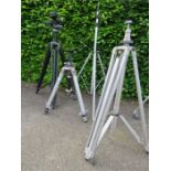 Four photography tripods, one by Gitza, and one by Linhoff with a Manfrotto leveller.