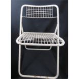 Two welded metal modernist chairs in white.