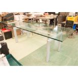 Long glass boardroom / dining table with 2cm thick glass on suction cups over elongated H form metal