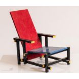 A scale model of The Red and Blue Chair, designed in 1917 by Gerrit Rietveld of the De Stijl art