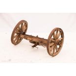 A pair of antique cart wheels, 63cm by 35cm.