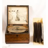 A 19th century table top polyphon with twenty discs, the box in mahogany with inlaid ivory stringing